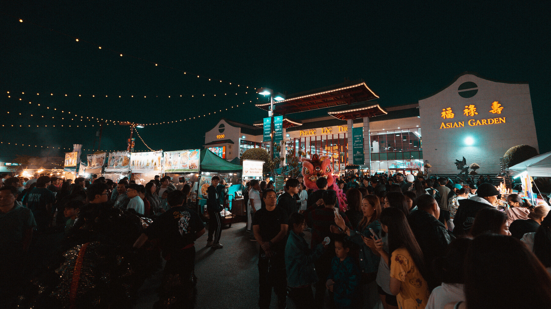 Night crowds attending the Asian Garden Night Market
